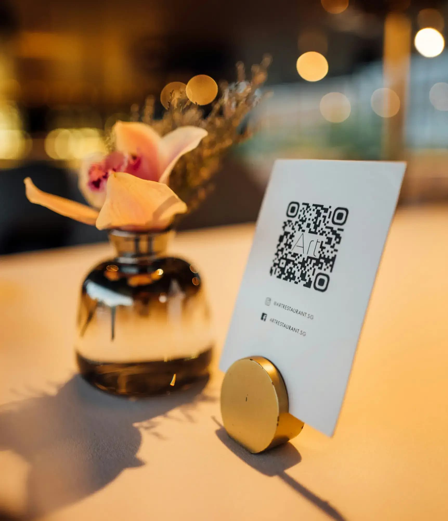 QR code on a studio front desk table for private member feedback